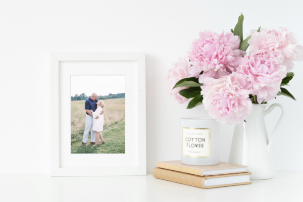 white picture frame pink peonies white pitcher candle tan neutral books minimal southern style